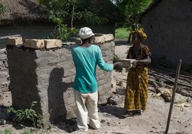 Volunteers building a latrine